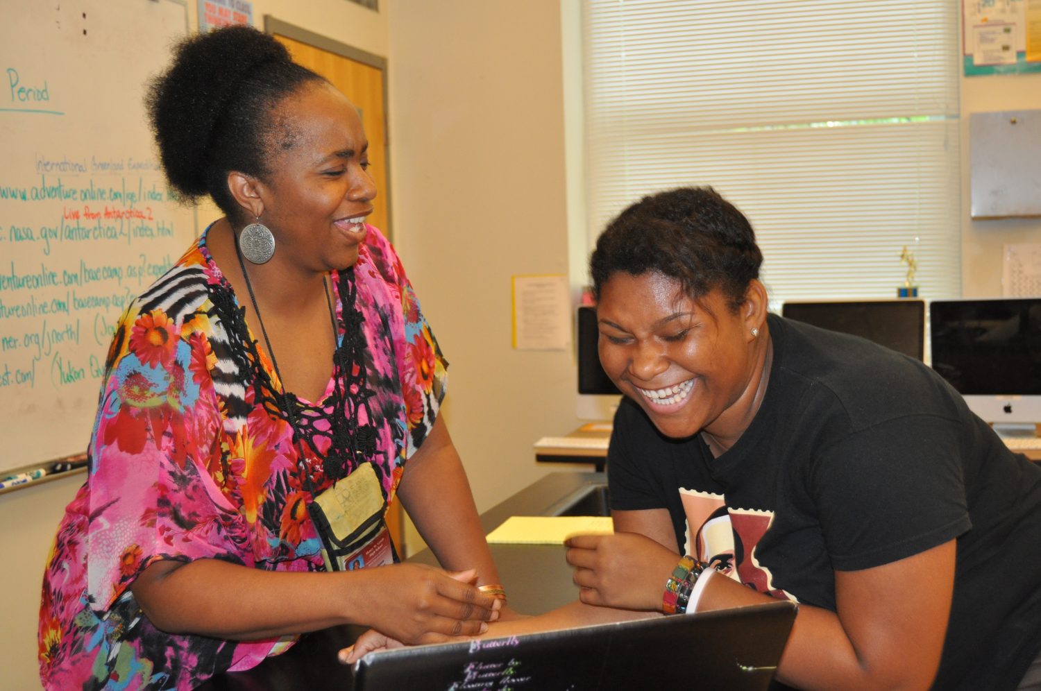 Dr.+Cadence+Spearman%2C+Gradys+2012+Teacher+of+the+Year%2C+is+pictured+with+a+student.+The+AP+and+Honors+Biology+teacher+discovered+shed+earned+the+accolade+after+receiving+a+text+message+from+a+faculty+member.+I+was+estatic%2C+she+said.+As+long+as+she+can+play+a+part+in+her+students+success+outside+of+the+classroom%2C+she+says%2C+she+will+continue+to+teach.