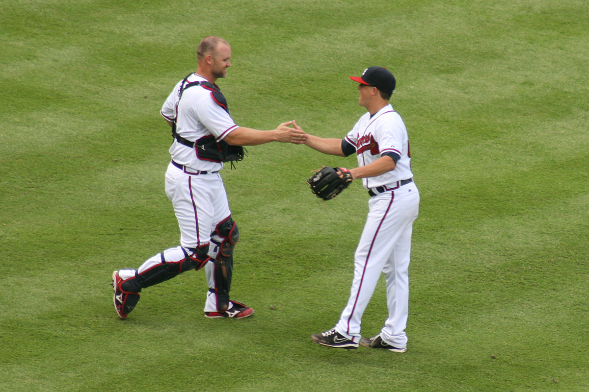 STRUCK OUT, SEALED, DELIVERED: Atlanta catcher David Ross congratulates pitcher Medlen after the teams’ 6-1 win against the Rockies Monday. Medlen pitched the entire game, managing to strike out a season-high 12 batters, including the last two he faced, before the victory was sealed (caption by Caitlin Lochridge),