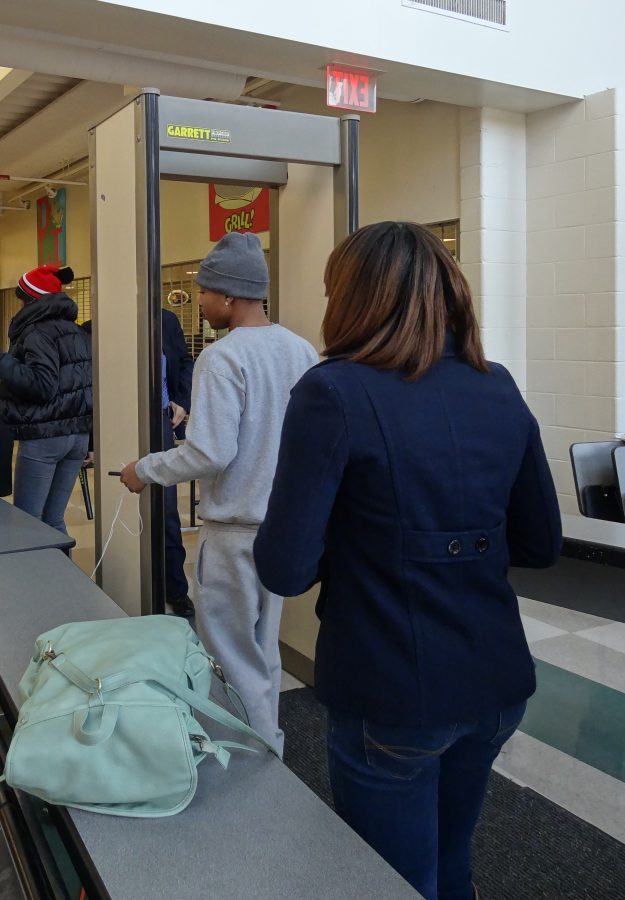 From the 8th Street entrance to the cafeteria, students walk through a metal detector to begin the day.  