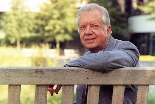 Former President Jimmy Carter sitting outside the Carter Center. 
Credit: Rick Diamond/The Carter Center