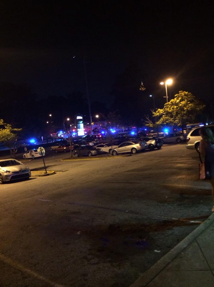 Victim Keiunte Wallace finds sanctuary in a nearby restaurant, leaving blood in the parking lot of Midtown Plaza. Photo by Carolyn Capelouto.