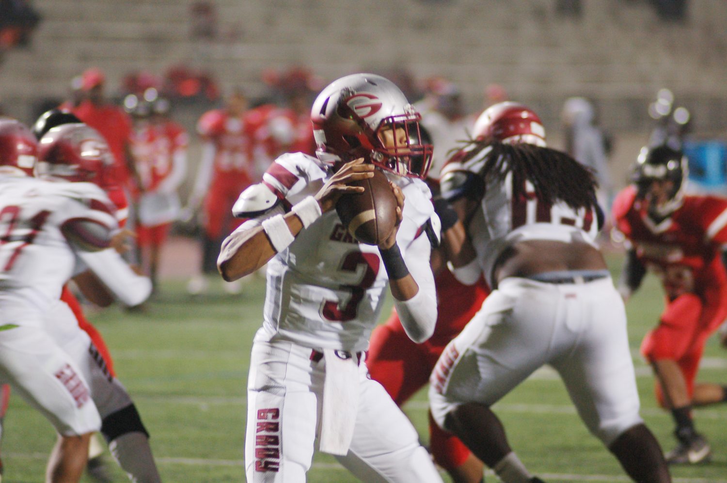 Junior quarterback Caylin Newton looks for a receiver in the Nov. 5 game against Stone Mountain.