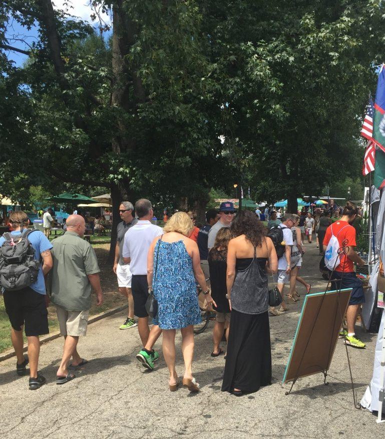 Atlanta residents and tourists alike inspect local art during the 8th annual Piedmont Park Arts Festival.