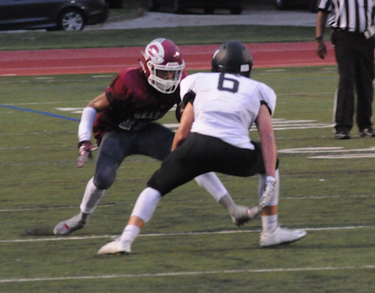 Senior running back Jacquez Sloan jukes defender after catching screen pass for a 35-yard gain. 