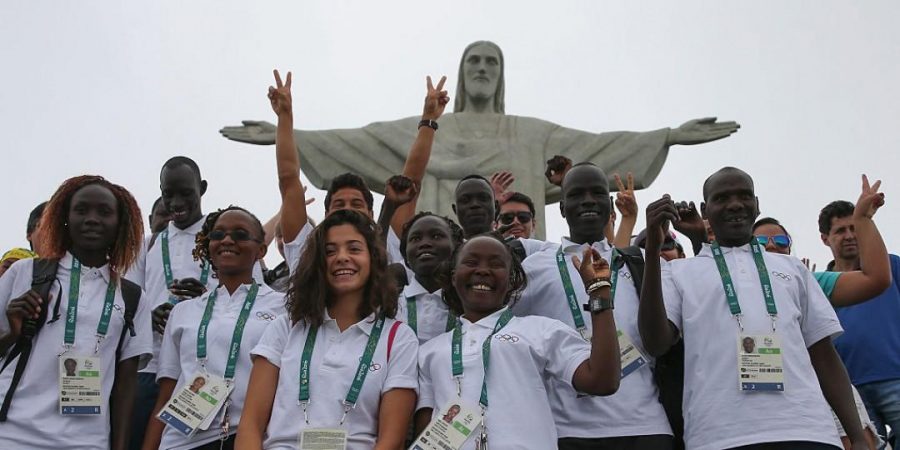 Team Refugee poses in front of Christ the Redeemer at the 2016 Olympics.