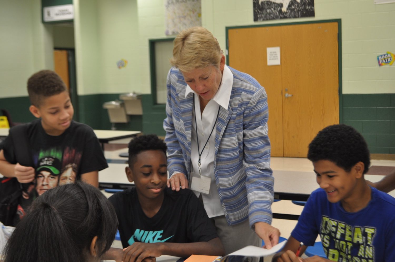 Dr. Betsy Bockman helps an Inman Middle School student with homework before school begins. Bockman plans to bring the same commitment to the school to her new job as interim principal of Grady, starting Sept 12. 