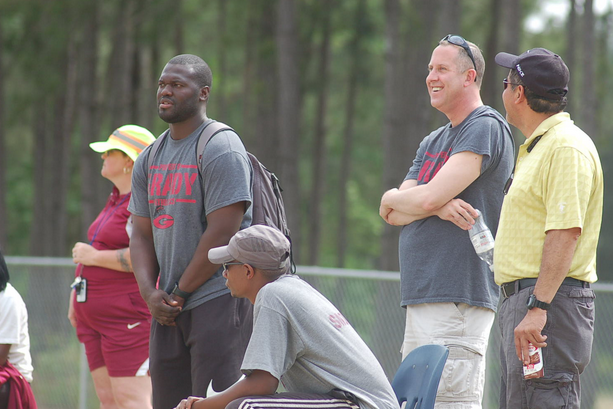 Principal Guiney looks on as the track team participates in state qualifiers at Eagles Landing Christian Academy. 