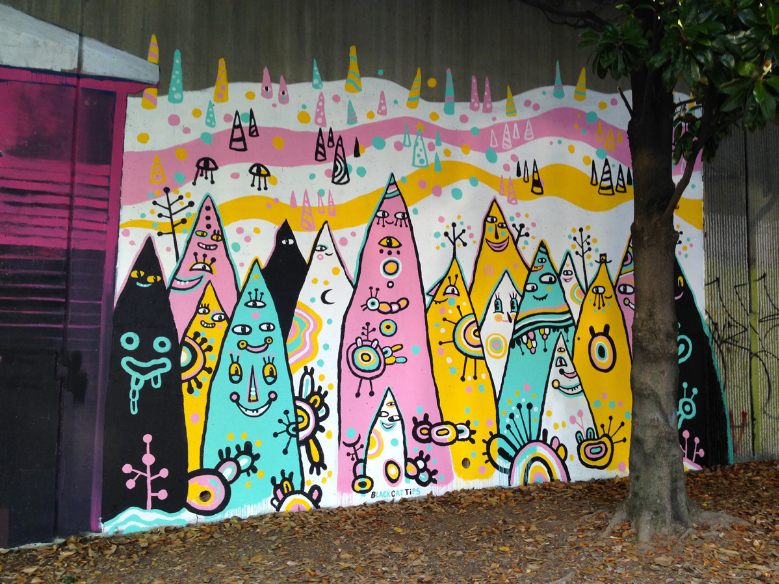 "The Pointy People," a mural created by Kyle Brooks, aka street artist Black Cat Tips, for Forward Warrior. 