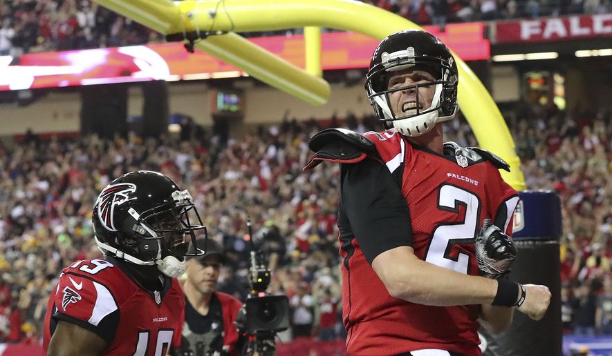 Quarterback Matt Ryan celebrates after a 14 yard run into the endzone. Ryan had an impressive five touchdowns on the day leading to the dominating win.
 Photo courtesy of the Associated Press