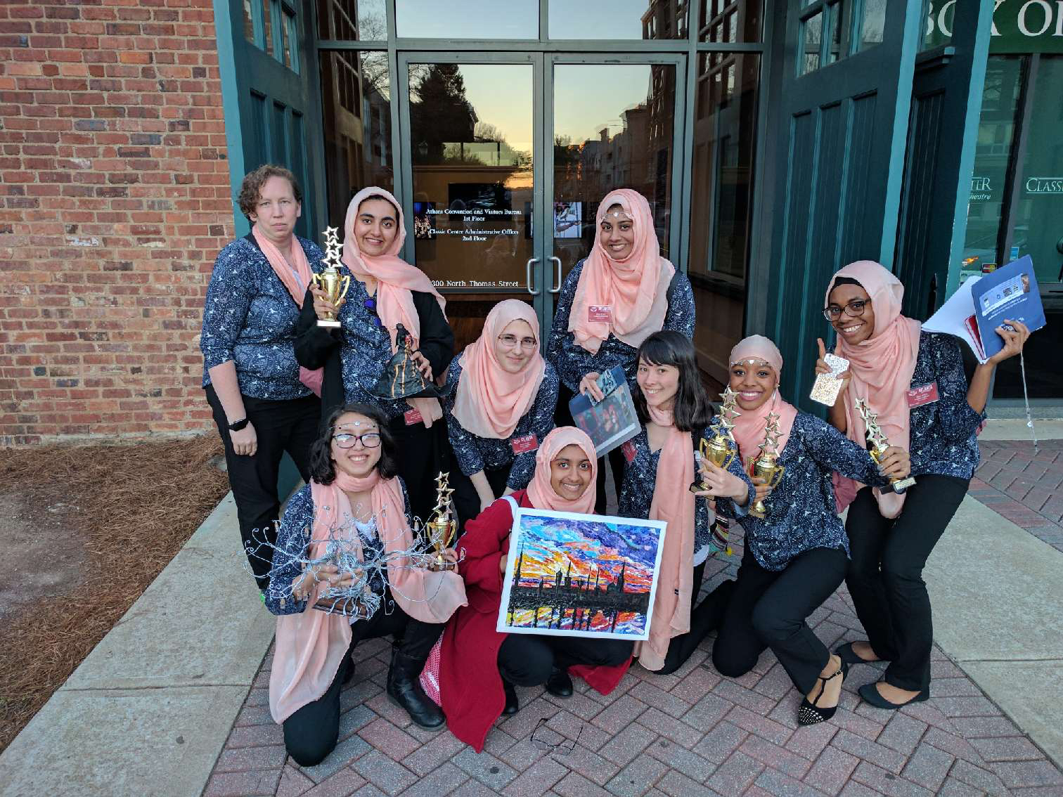 The Grady Muslim Students Association showcase their awards won during MIST, including second in photography, first and third in 3D art, and first place in spoken word.