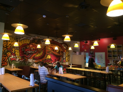 The blazing mural, painted by Brandon Sadler, depicts a guardian dragon that watches over the guests.