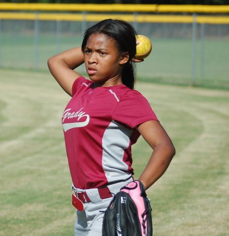 A Lady Knights player, Nariah Moore, warms up prior to a softball game on Aug. 17 against Therrell at Crim High School. Therrell won the game 24-2. Grady is looking to improve from a winless 2016 season.