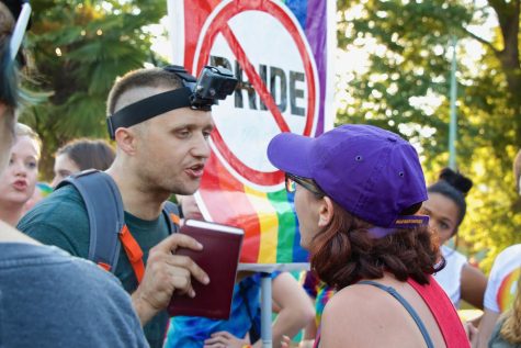 A group of protestors at Atlanta’s annual Pride Festival in Piedmont Park confronts a festival-goer, one of whom has an anti-pride sign. Some Grady students have expressed that, while most students and teachers are accepting, they occasionally feel excluded or unable to be themselves.