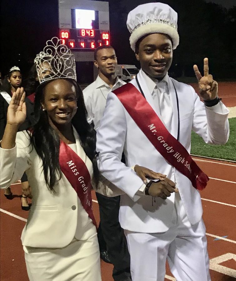 Miss Grady Amani Watkins is escorted into Grady Stadium by Mr. Grady Aaron Burrus before the Knights 30-26 homecoming victory on Friday, Oct. 13.