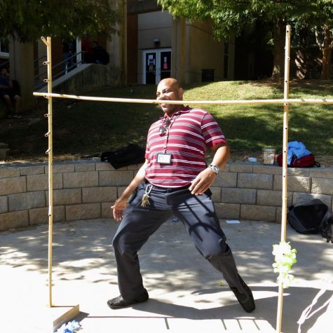 Assistant Principal Rodney Howard joined in the luau fun and tried the limbo on Tropical Tuesday, Oct. 3 during Spirit Week.