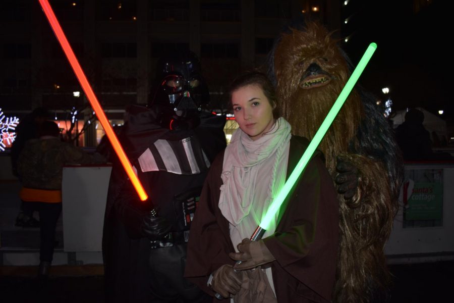 Skaters dressed as Chewbacca, Princess Lea, and Darth Vader, enjoy the holiday spirit.
