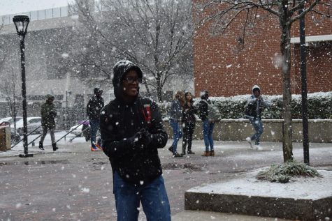 As snow fell in fluffy flakes, students threw spontaneous snowballs.