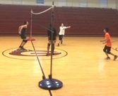 Freshman Adham Attia hits a winning shot past freshman Diego Gonzalez and senior Ash Sullivan, during a boys volleyball practice. The team is sponsored by teacher Lee Pope.