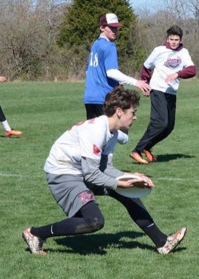 Dusenbury dives for frisbee during practice.