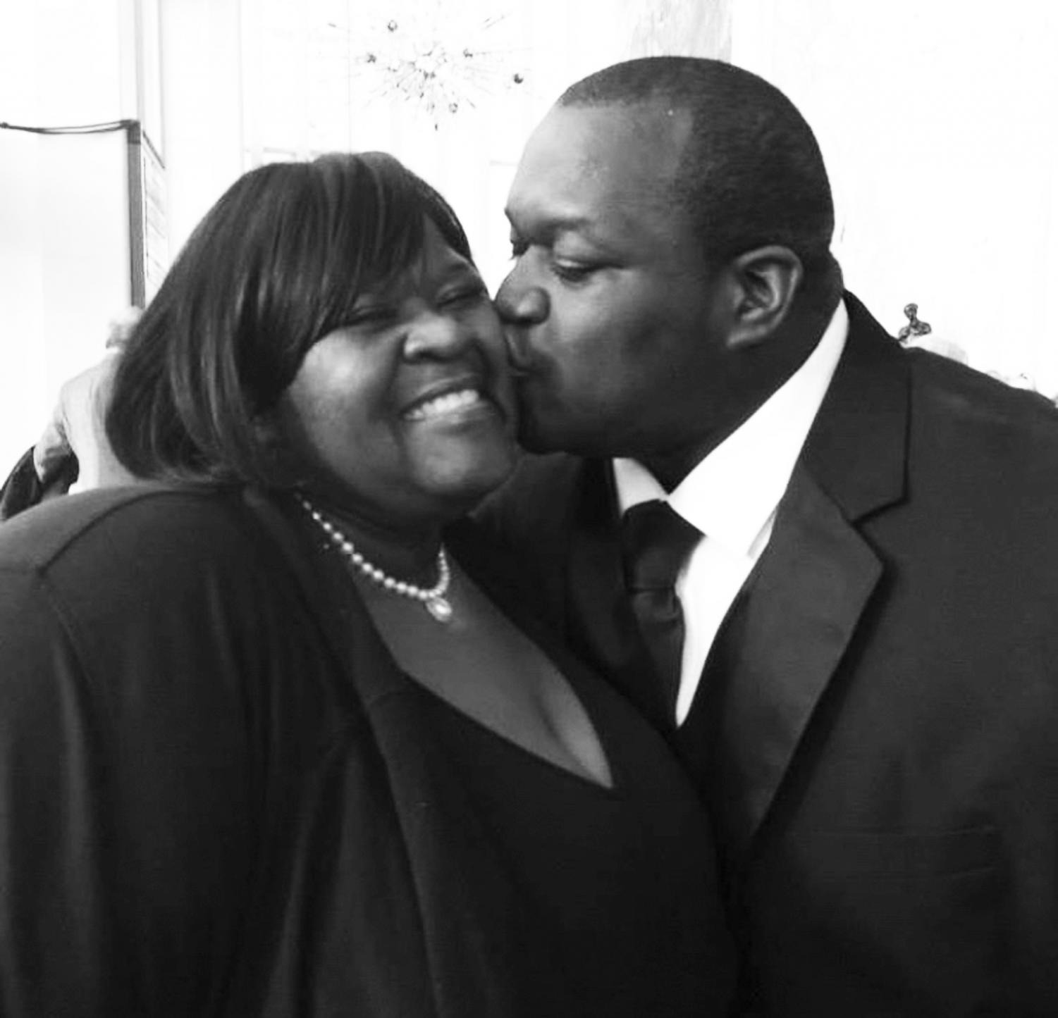 PROUD MOTHER: Opera singer Reginald Smith Jr. kisses mom and Grady staff member Bea Hall. Hall supported her son through school and his international career despite many obstacles along the way.