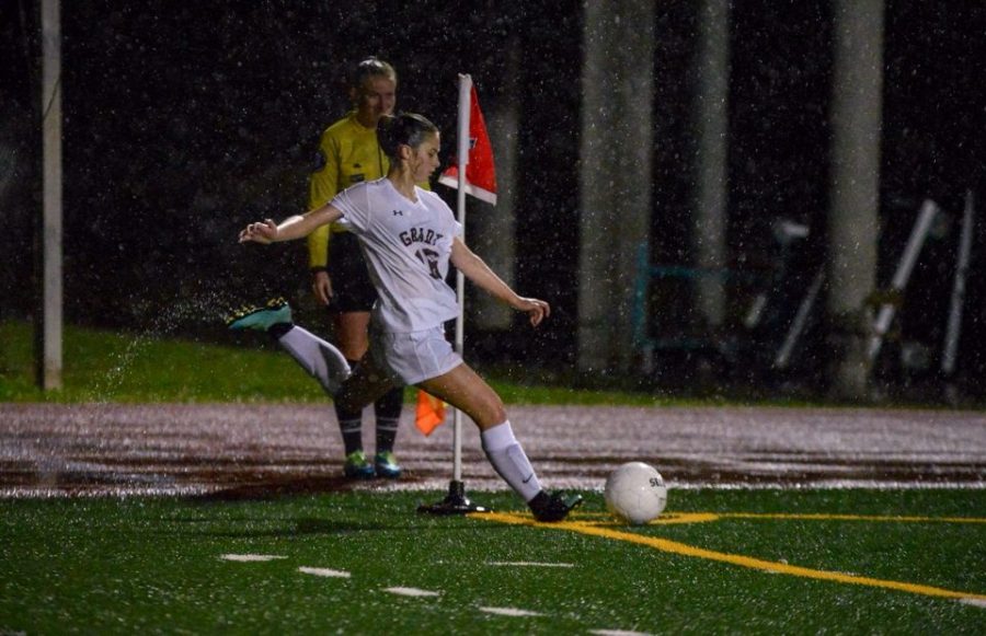 BRINGING+ON+THE+STORM%3A+Freshman+defender+Isabel+Pruitt+prepares+to+take+a+corner+in+a+rainy+game+against+Riverwood.+The+girls+ended+with+a+1-0+loss+to+Carrollton+in+the+playoffs.