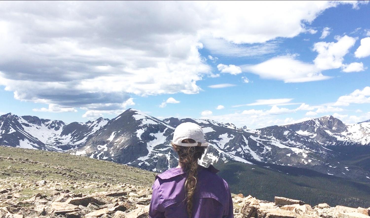 LOOKING TOWARD THE HORIZON: Senior Walden jones looks out at the St. Vrain's mountain range in Colorado after spending an entire day hiking to the top in the summer of 2012 with her friend and fellow senior Eve Robinson. The duo travelled around and hiked through parts of Colorado and are planning another adventure for this summer.