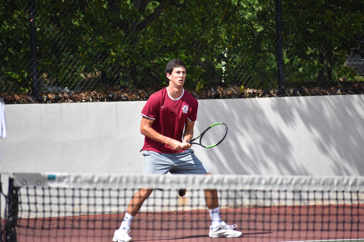 FIGHTING UNTIL THE END: Josh Wolfe stands ready to return serve against Flowery Branch. The Grady boys failed to reach the Elite Eight this season.