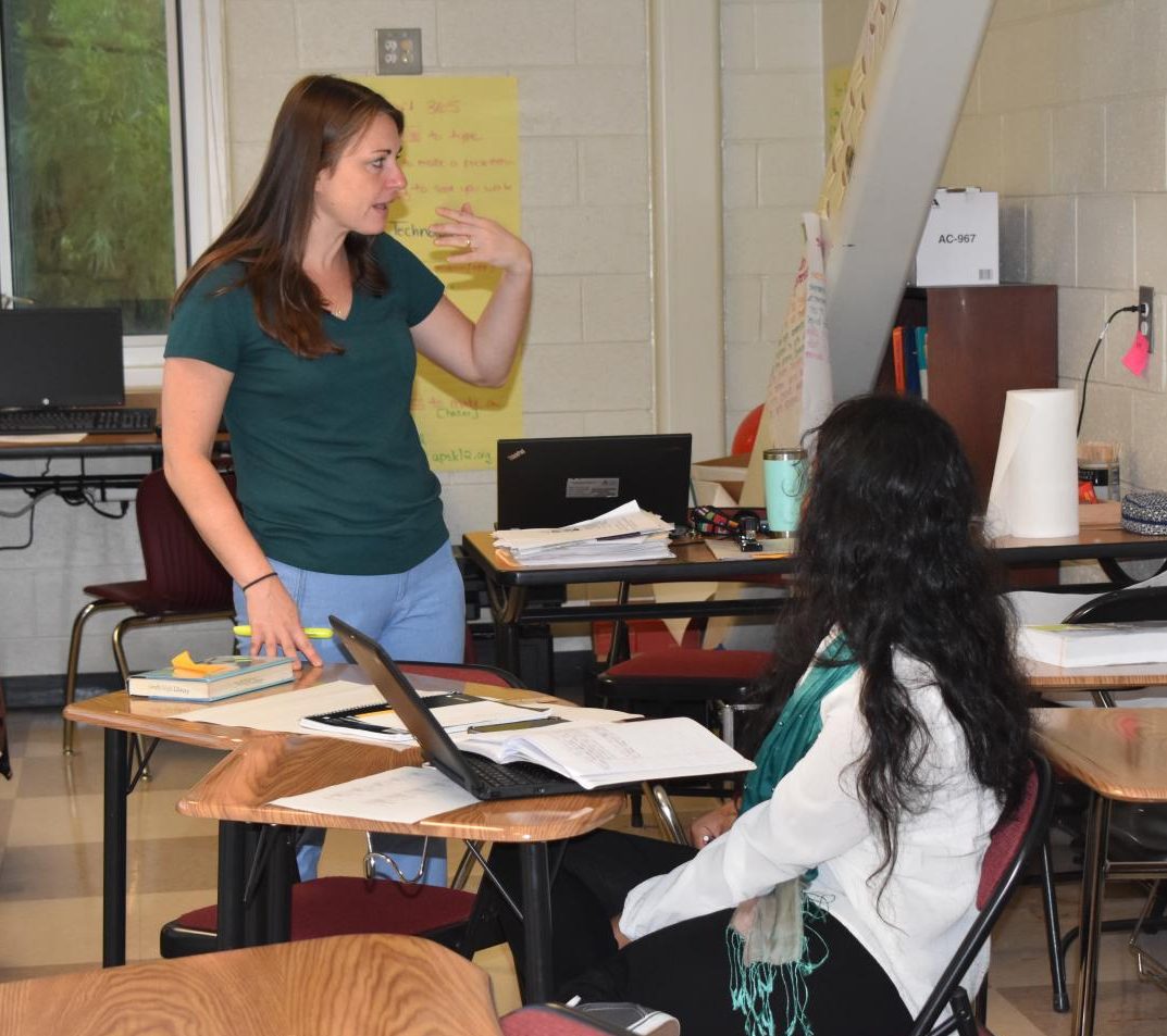 A TEACHING MOMENT: ESOL teacher Katherina Maryska explains a concept to senior Sabiha Akter. Akter is from Bangladesh where the official language is Bengali. Maryska uses body language to aid in learning.