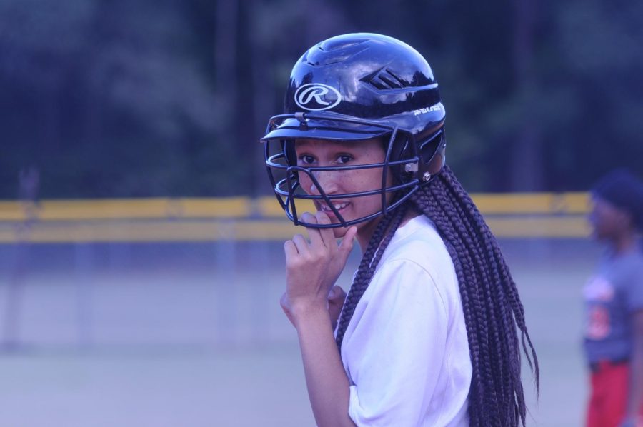 Junior Serenity Chambers smiles for the camera as she gets ready to bat.