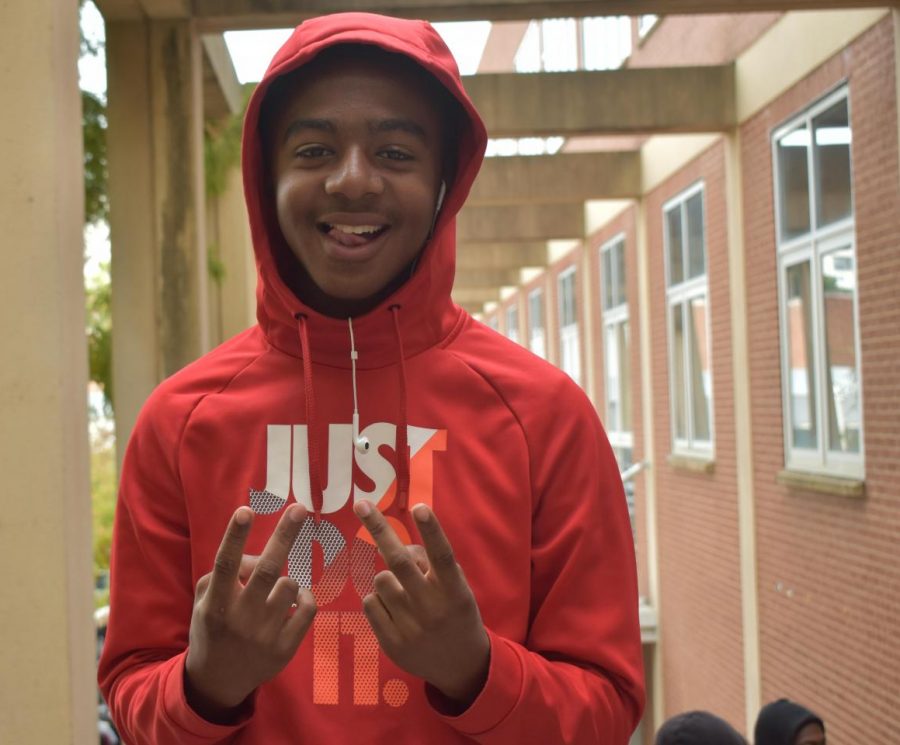 Cornelius Ellison smiles as he explains that he plays two versions of football.