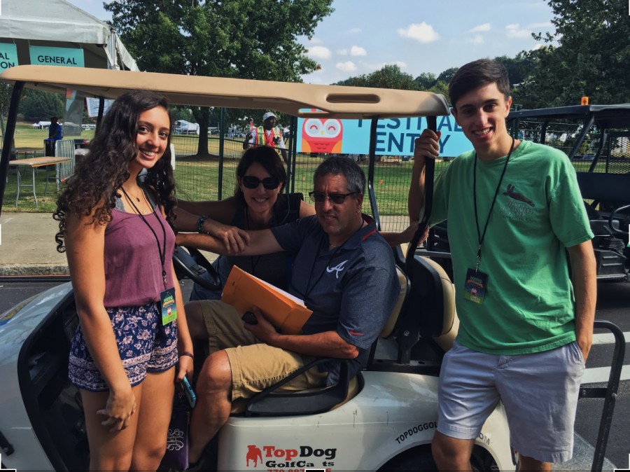 Music+Midtown+2017%3A+David+and+Amy+Helberg+along+with+their+two+kids%2C+ride+around+the+festival+in+a+golf+cart+to+make+sure+things+are+running+smoothly.