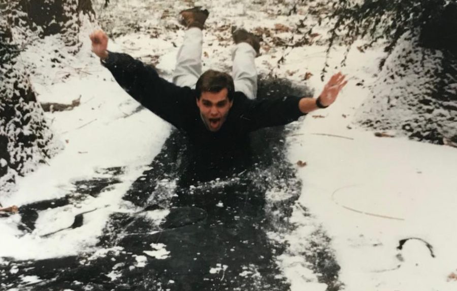 Nicolai Curtis slides across a frozen pond at the Knoxville Zoo in Knoxville, TN where interned as a zoo keeper during college.