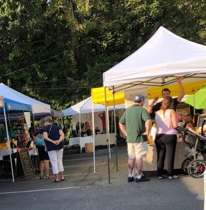 Shoppers browse for organic foods on an early fall morning during the weekly Morningside Farmers Market. The market opens every Saturday at 8 a.m.