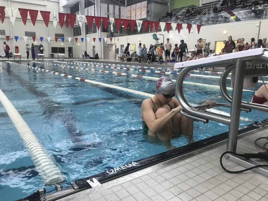 NO DAYS OFF: Lindsay Schroeder competes in backstroke at Washington Park pool during the APS met. The team practices four times per week in preparation for competition; their next meet is Dec. 15.