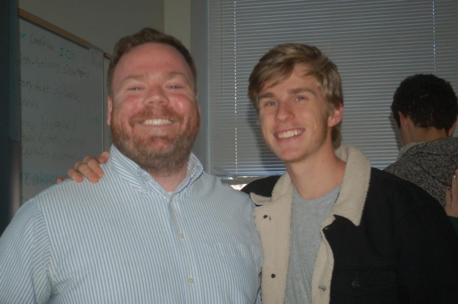 TEACHING FOR JOY: Teacher satisfaction is of utmost importance at school. Psychology teacher Andrew Copeland poses with senior Jacob Greenhill. 