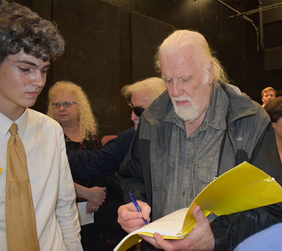 Playwright of Waffle Palace and Grady alum Eddie Levi Lee signs the script of Jack Dicarlo, who played John in the show. Waffle Palace is based on the crazy things that happen in a Waffle House at 3 a.m. 