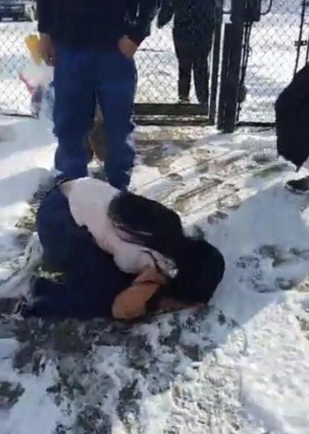 Tyra Patterson kisses the snow-covered pavement upon her released from a 23-year prison term on Christmas Day in 2017.