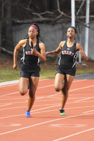 Large group, new coach to help girls track