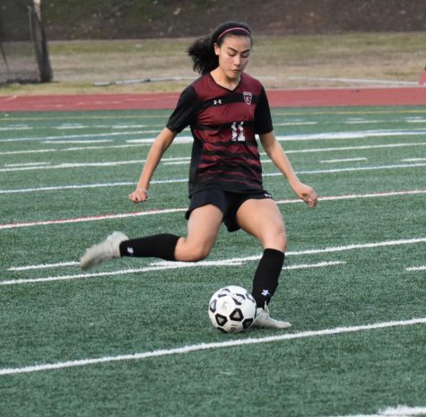 Mia Wood, who is now playing college soccer, takes a free kick in a game against North Atlanta last season. Soccer tryouts started Jan. 13 for this season.