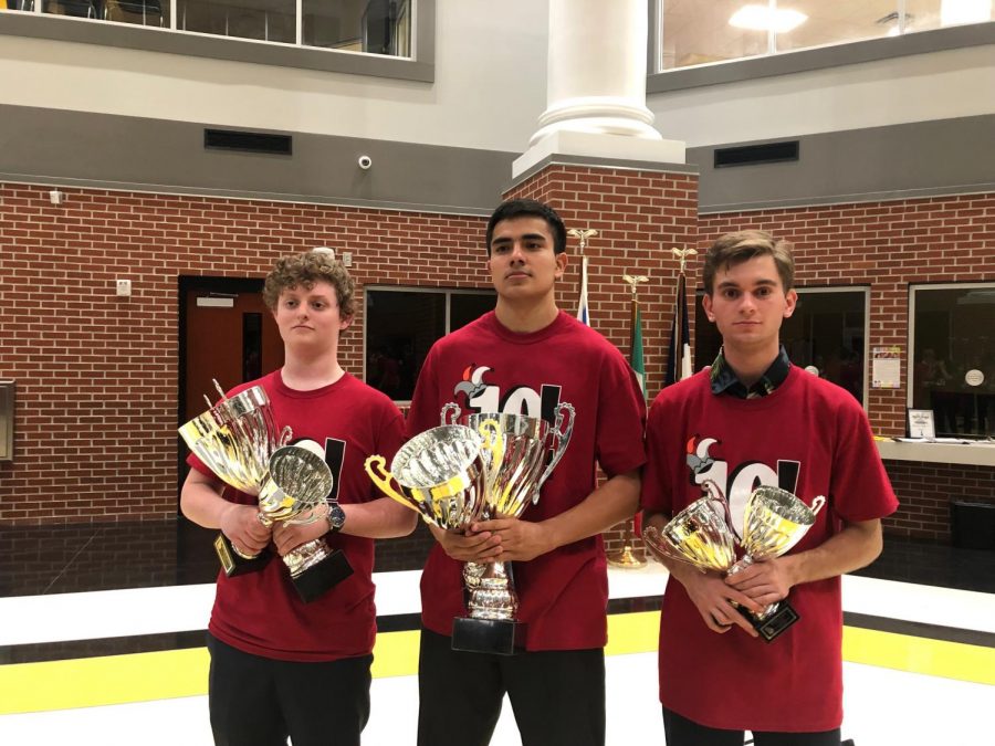 Seniors+Harrison+Gray%2C+Franky+Fernandez+and+Eric+Slovensky+pose+with+serious+faces+and+trophies+in+hand+at+the+State+competition+in+Valdosta%2C+GA.+