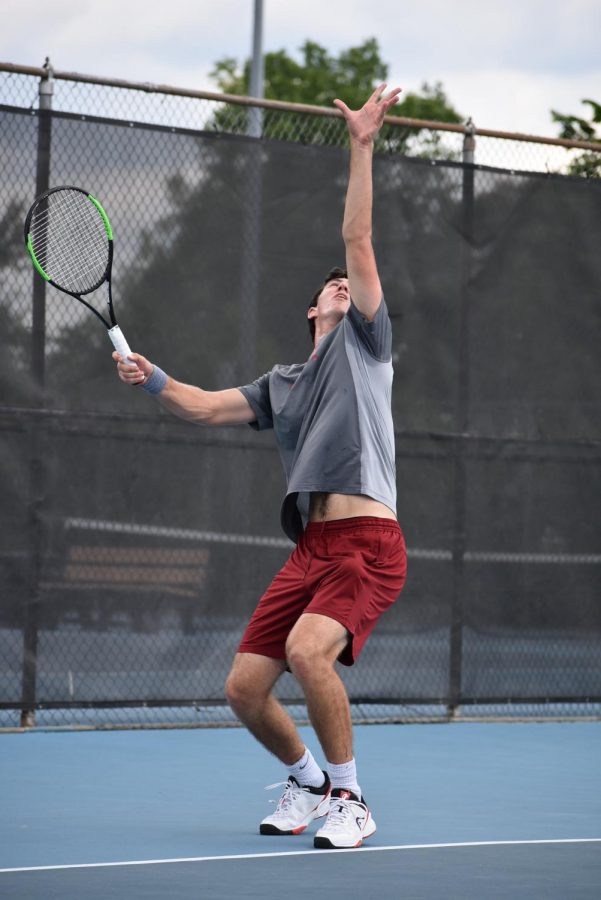 SERVING SECONDS: Senior and number one singles player Josh Wolfe sets up to serve in his match against Chamblee Charter in the state finals. This is the first time ever the boys varsity tennis team has made it to the state finals. The Knights lost 3-0.