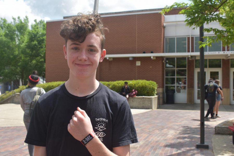 Sophomore Brody Dowling shows off his Shaky Knees music festival wristband. Shaky Knees is May 3-5 at Central Park in Atlanta.