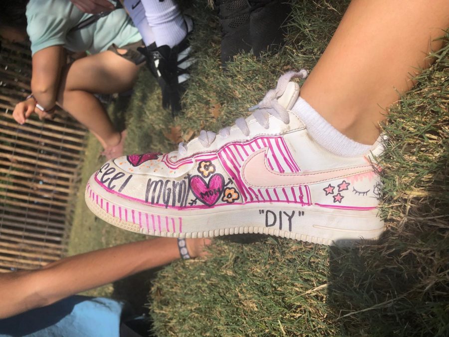 Sophomore Grace Porges was sporting these diy nike air force ones. Diy clothing is becoming a rising trend at festivals, and this was Porges’s own interpretation. Closed toed shoes are the best option in the large crowds.