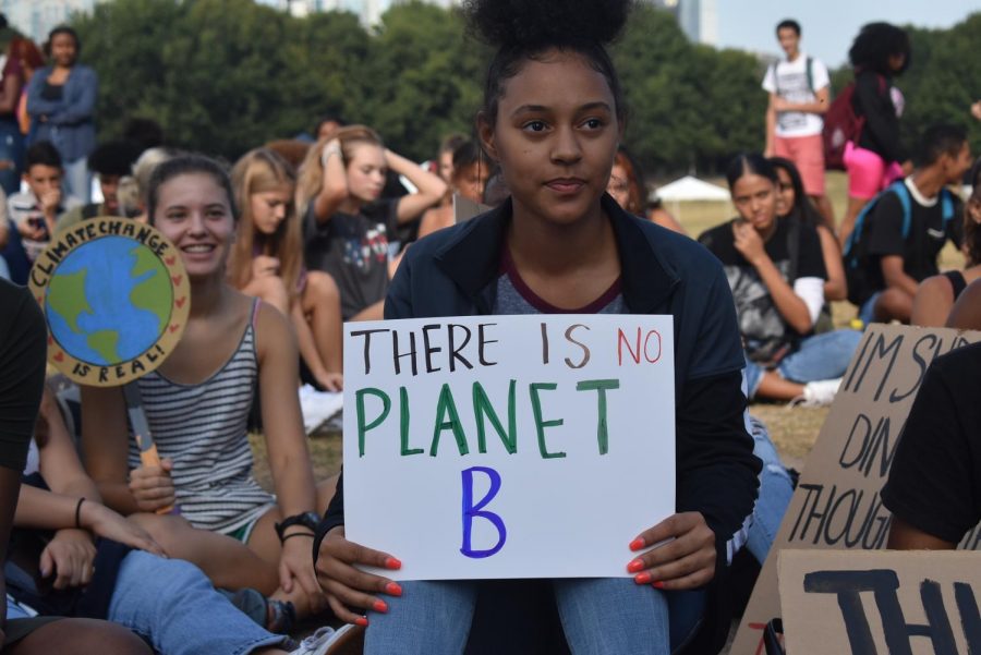 Junior+Amarie+Blackshear%2C+listens+to+a+speech+from+Danielle+Millburn%2C+as+she+holds+a+sign+reading%3A+%22There+is+no+Planet+B.%22+