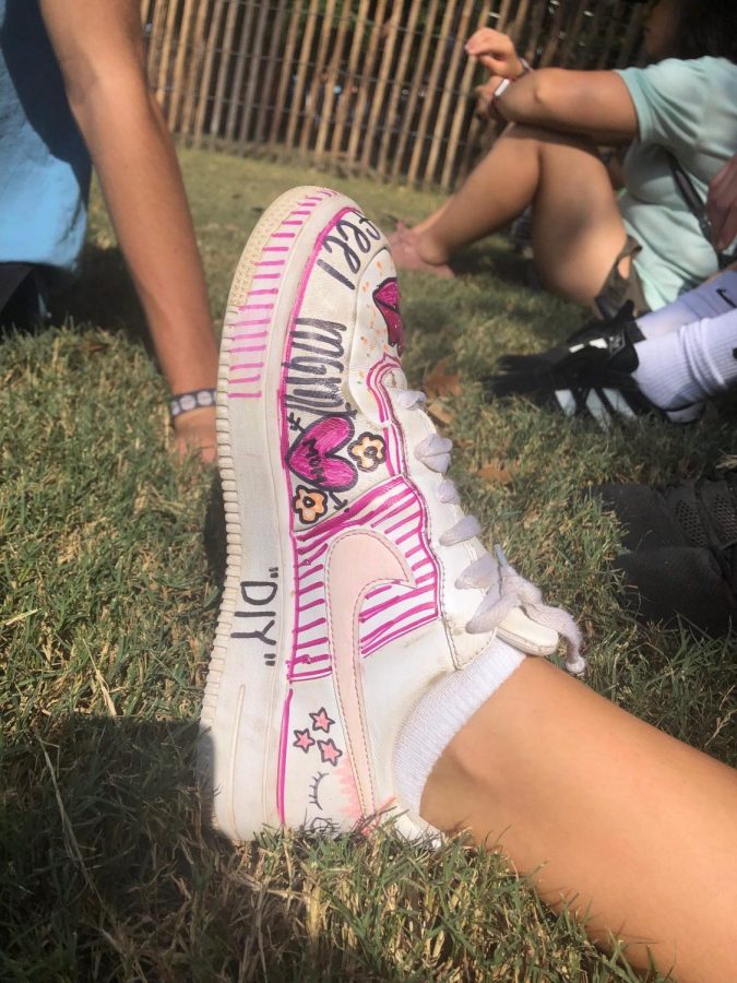 Sophomore Grace Porges was sporting these DIY nike air force ones. DIY clothing is becoming a rising trend at festivals, and this was Porges’s own interpretation. Closed toed shoes are the best option in the large crowds. 
