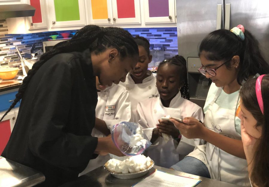 Junior Amelia Green teaches kids how to cook while she works at the Young Chefs Academy. Green loves to cook in her free time.