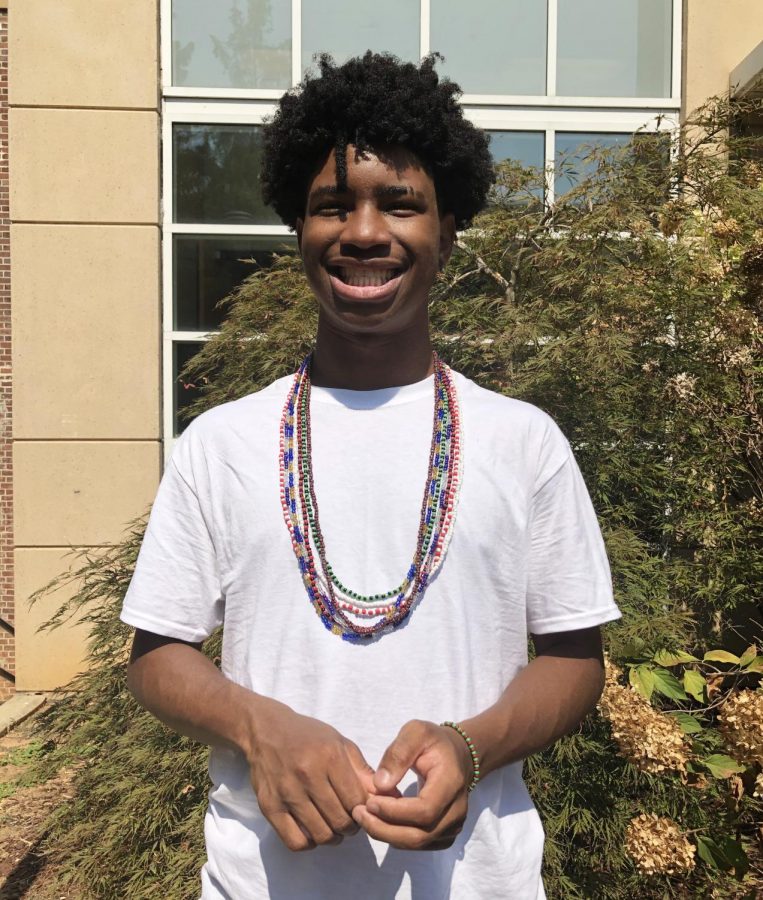 Junior Jeremiah Scott, who practices the African religion Ifa, wears his eleke beads around his neck which give him protection. Scott's beads mean life, protection, and his god, Oshun.