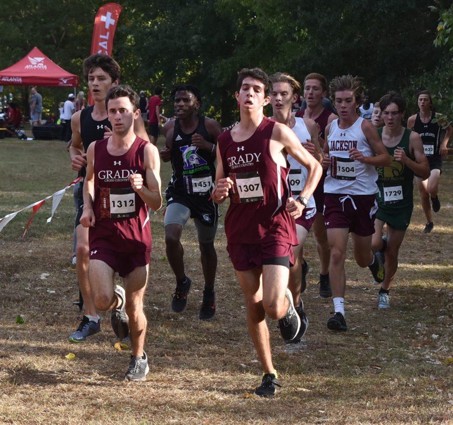 FINISH STRONG: Senior Bram Mansbach (left) and senior Kavi Jakes (right)  lead the pack at the APS City Championships on Oct. 8.  Mansbach went on to finish first place and Jakes went on to finish second overall. The Knights’ placed first overall in the meet.