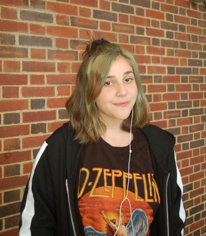 Sophomore Malori Switzer stands in the theater atrium during lunch.