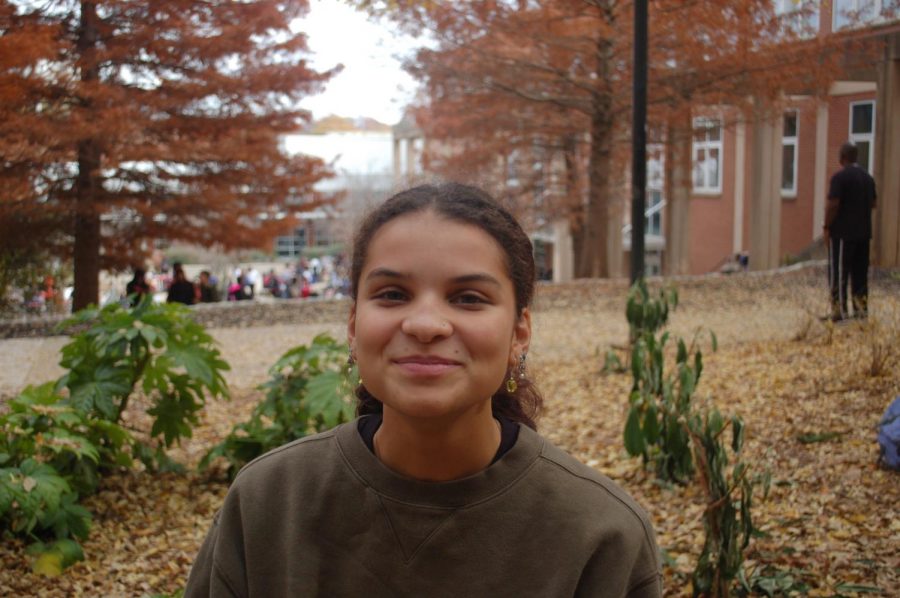Junior Zola Sullivan sits outside with her friends during lunch.